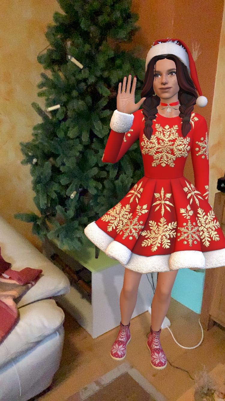 Frohe Weihnachten! Tamarena steht vor einem Weihnachtsbaum. SIe trägt ein rot-weißes Weihnachtskleid und winkt.